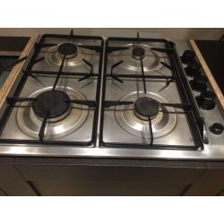 Gas hob with electric spark