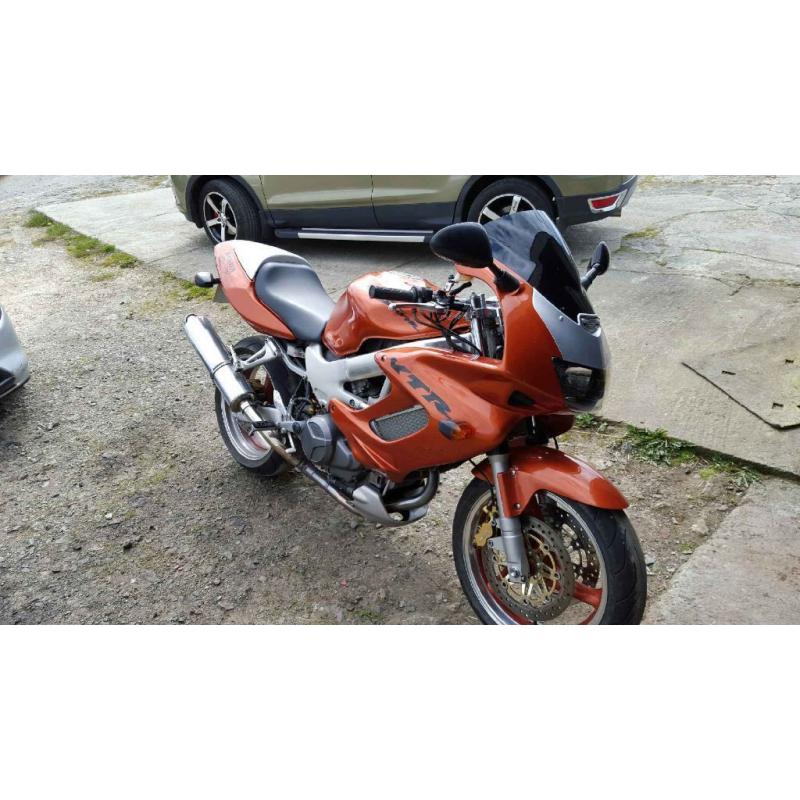 cheep first big bike !!! honda VTR 1000 in candy orange part x 1200 harly with EFI engine or why