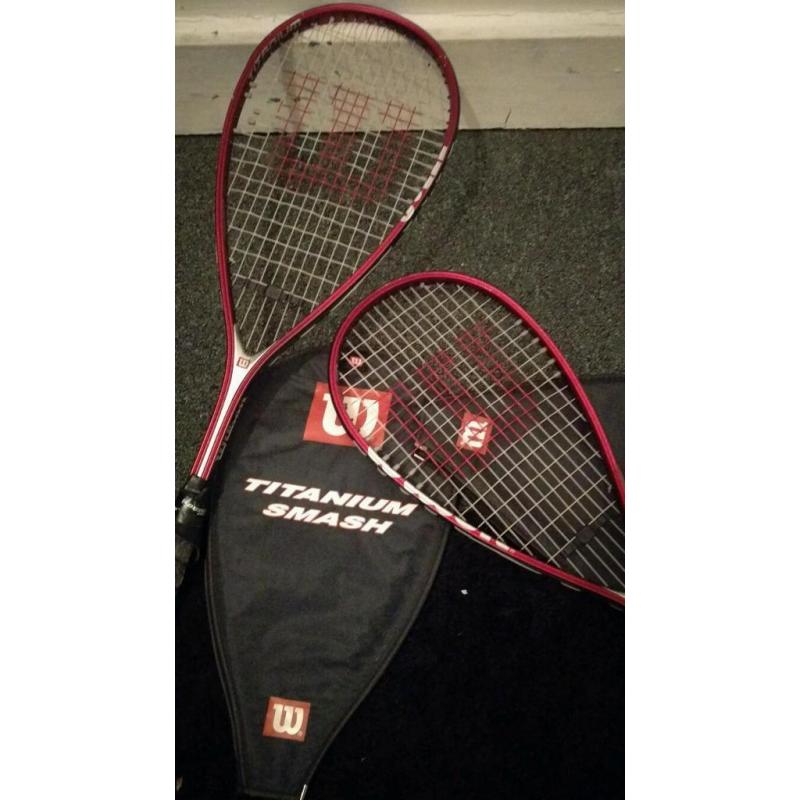 Two Titanium smash squash rackets