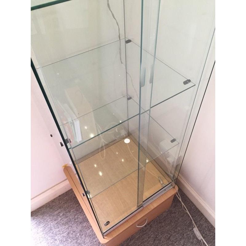 Glass display cabinet with lock and storage drawer
