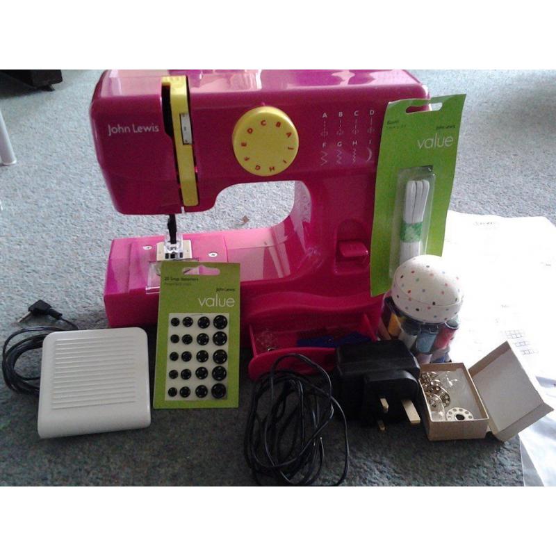 John Lewis Mini PINK Sewing Machine..............condition is excellent........available immediately