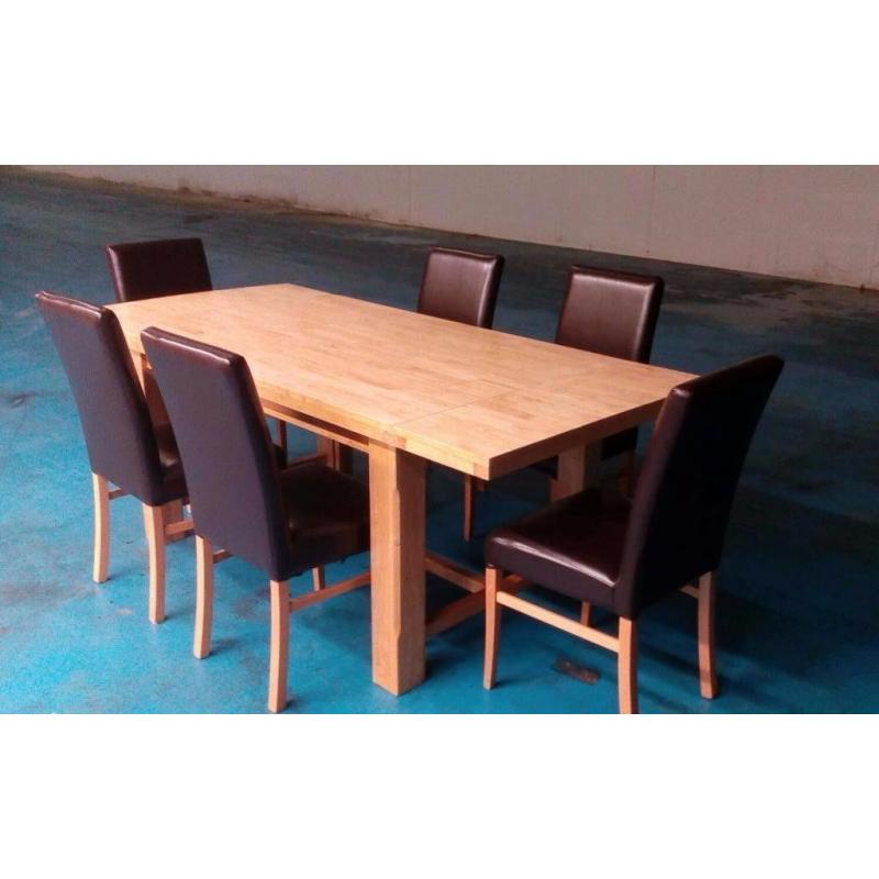 lovely extendable solid oak dinig table + 6 brown leather chairs