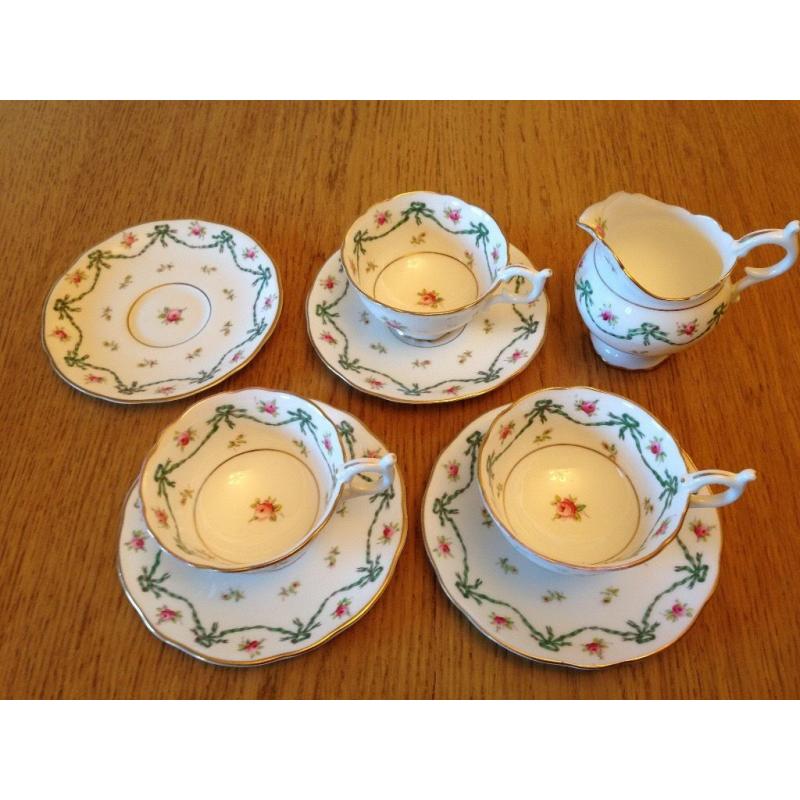 Antique Coalport 'Ribbon and Bow' cups and saucers for 3 people, also milk jug, early 1900s,