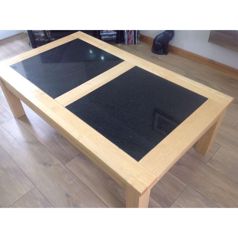 Coffee table with black granite inserts