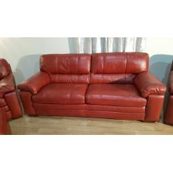 Ex-display Carolina red leather 3 seater, 2 armchairs and storage footstool
