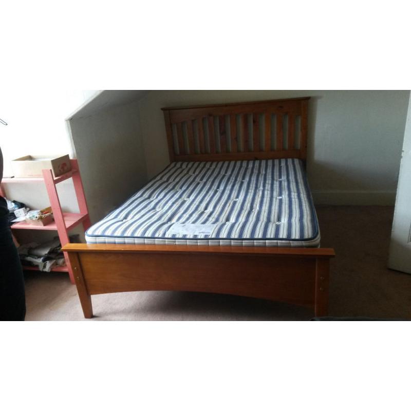 Queen-size wooden bed, including mattress