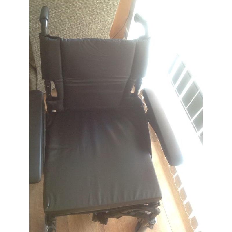 Folding travel wheelchair NEVER USED