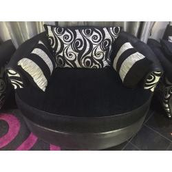 Black and white circular sofa, which rotates left and right 360 Degrees.