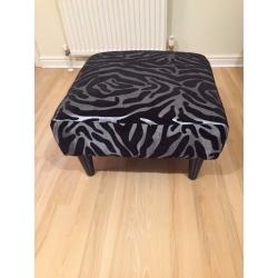 Elegant Silver/Black animal print armchair with matching footstool