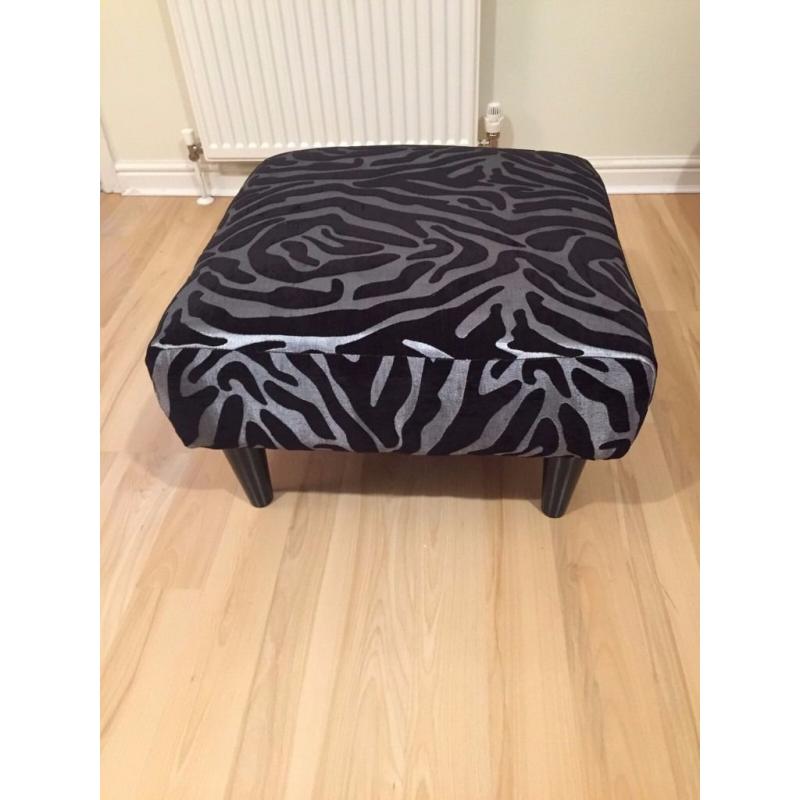 Elegant Silver/Black animal print armchair with matching footstool