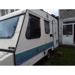 Old solid Adria Caravan with awning and hook up