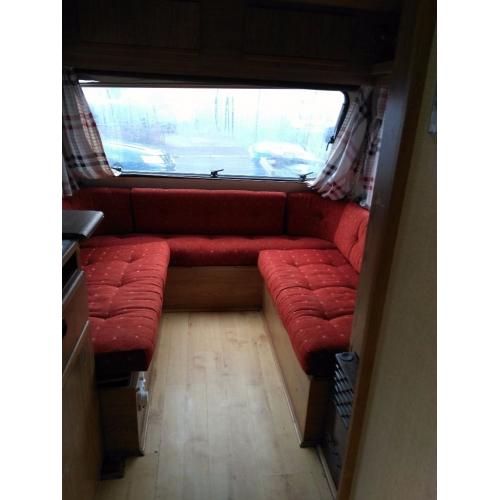 Old solid Adria Caravan with awning and hook up