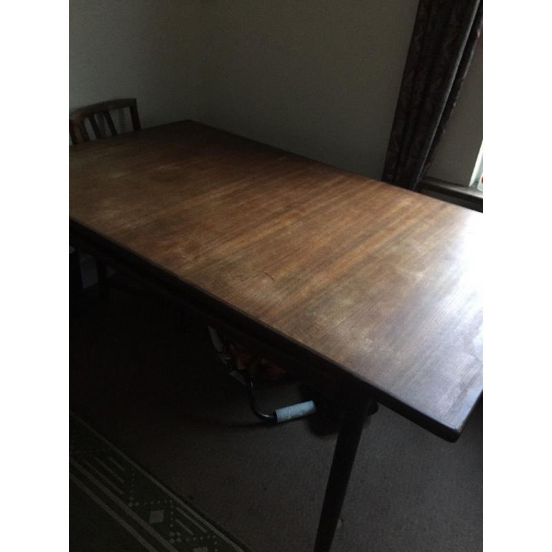 Dark wooden table for sale, extendable from sides