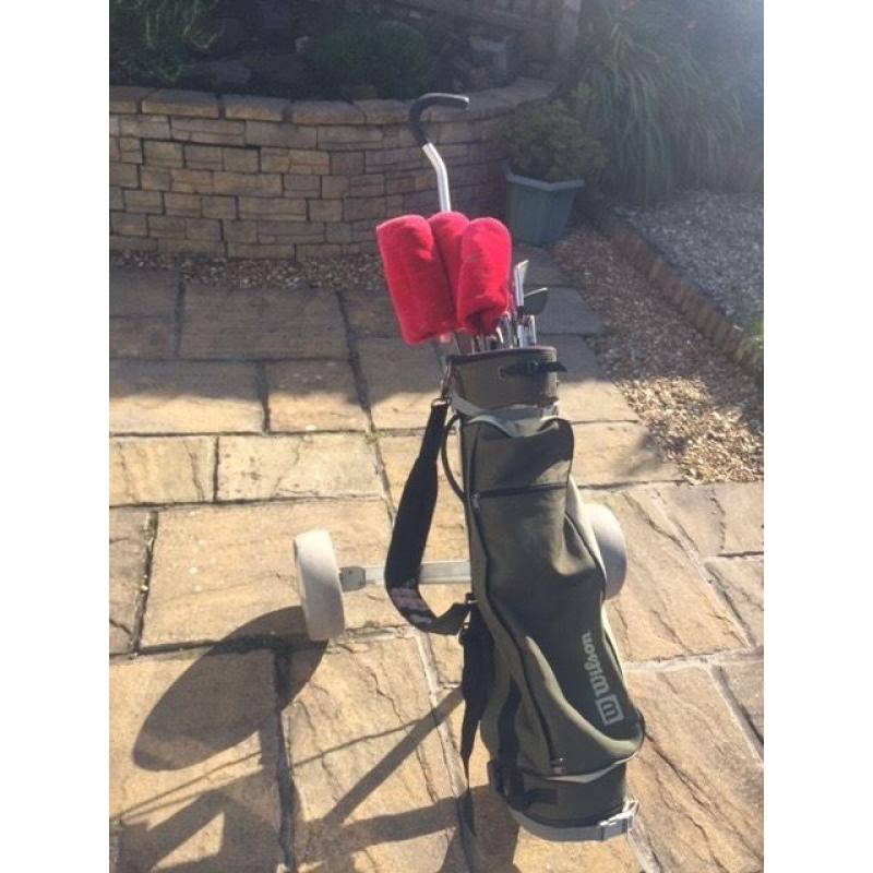 Wilson set of 11 clubs with trolley, bag, balls and tees.