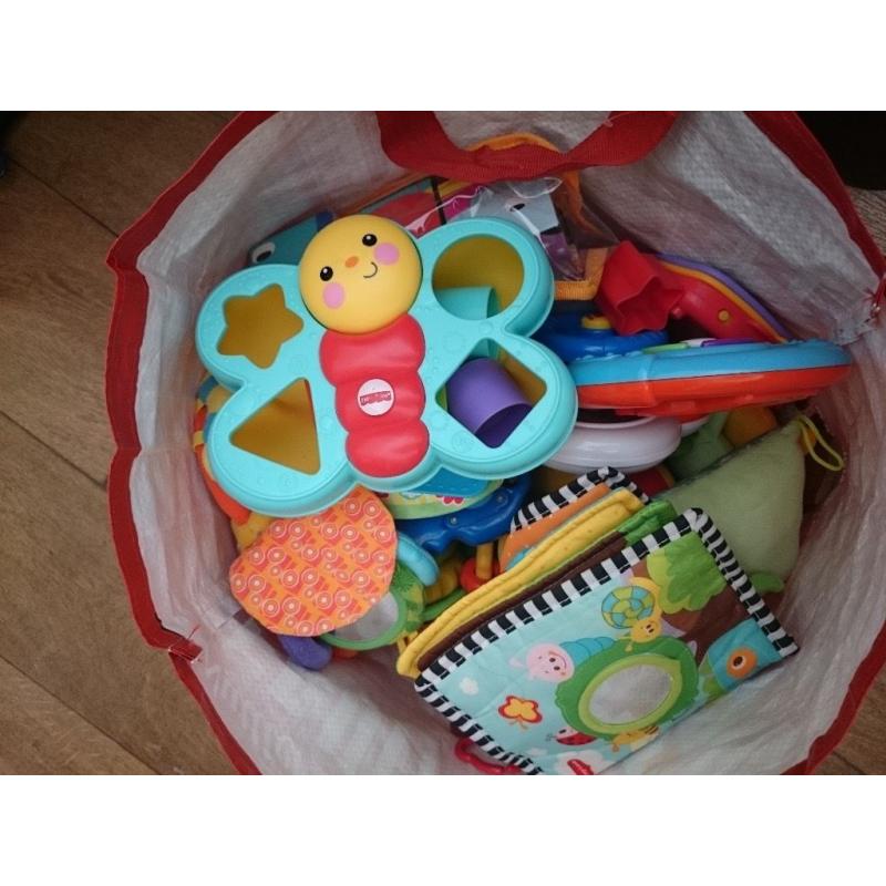 Bag of bay toys and rattles