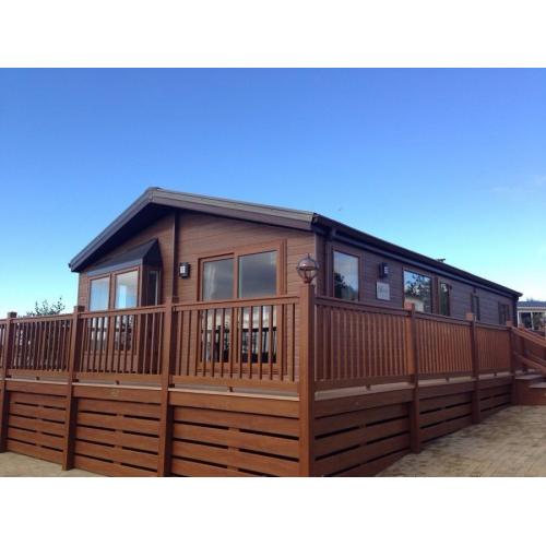 (STATIC CARAVAN)LUXURY WILLERBY LODGE FOR SALE NORTH WALES- LARGE DECKING INCLUDED WITH LAKE VIEWS