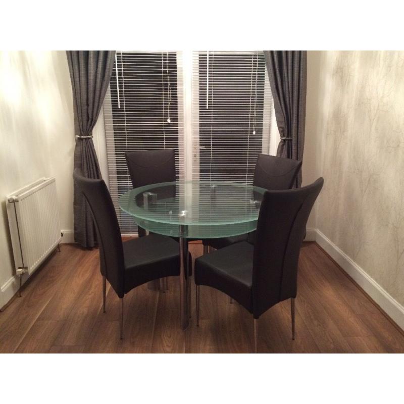 Round Glass dining table and chairs