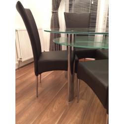 Round Glass dining table and chairs